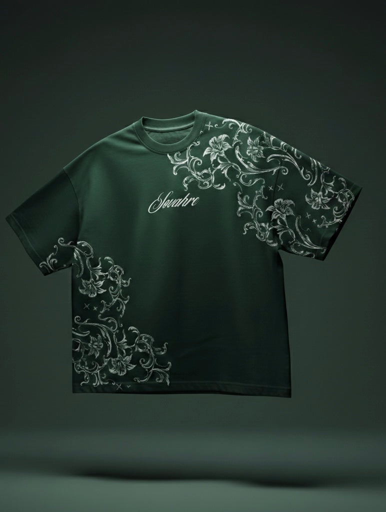 Green t-shirt with white floral patterns on a dark background