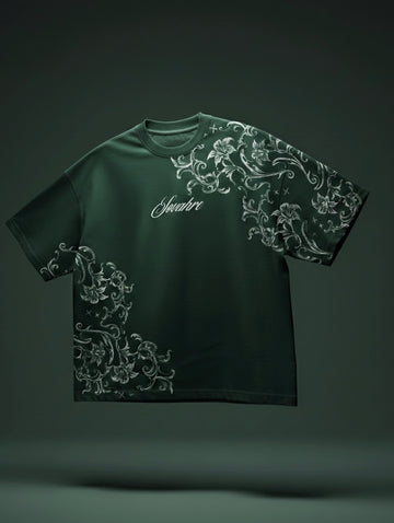 Green t-shirt with white floral patterns on a dark background
