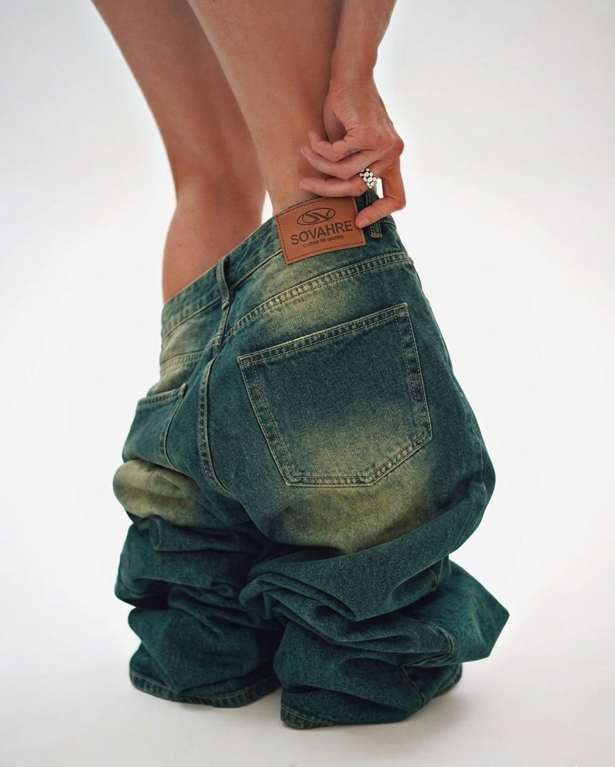 Green baggy jeans with a brand label on a white backgroundshop_this_look_amDhCa